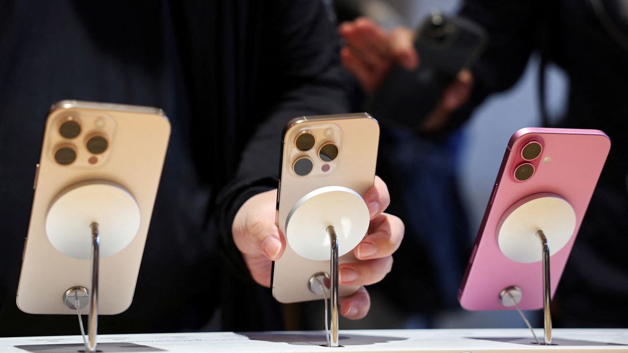 A man checks an iPhone 16 Pro as the new iPhone 16 series smartphones go on sale at an Apple store in Beijing, China September 20, 2024.