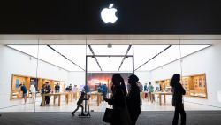 gettyimages-2197059415-2 People walk by an Apple store at the Westfield UTC shopping center on January 31, 2025 in San Diego, California.